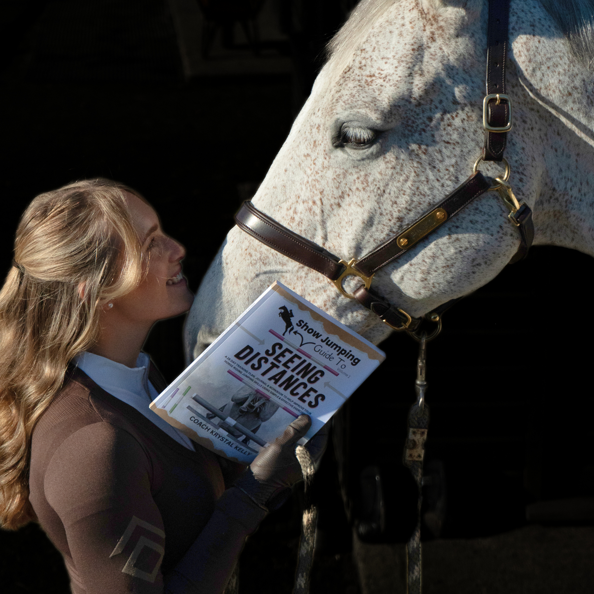 Horse Rider Holding A Show Jumping Guide To Seeing Distances Training Book